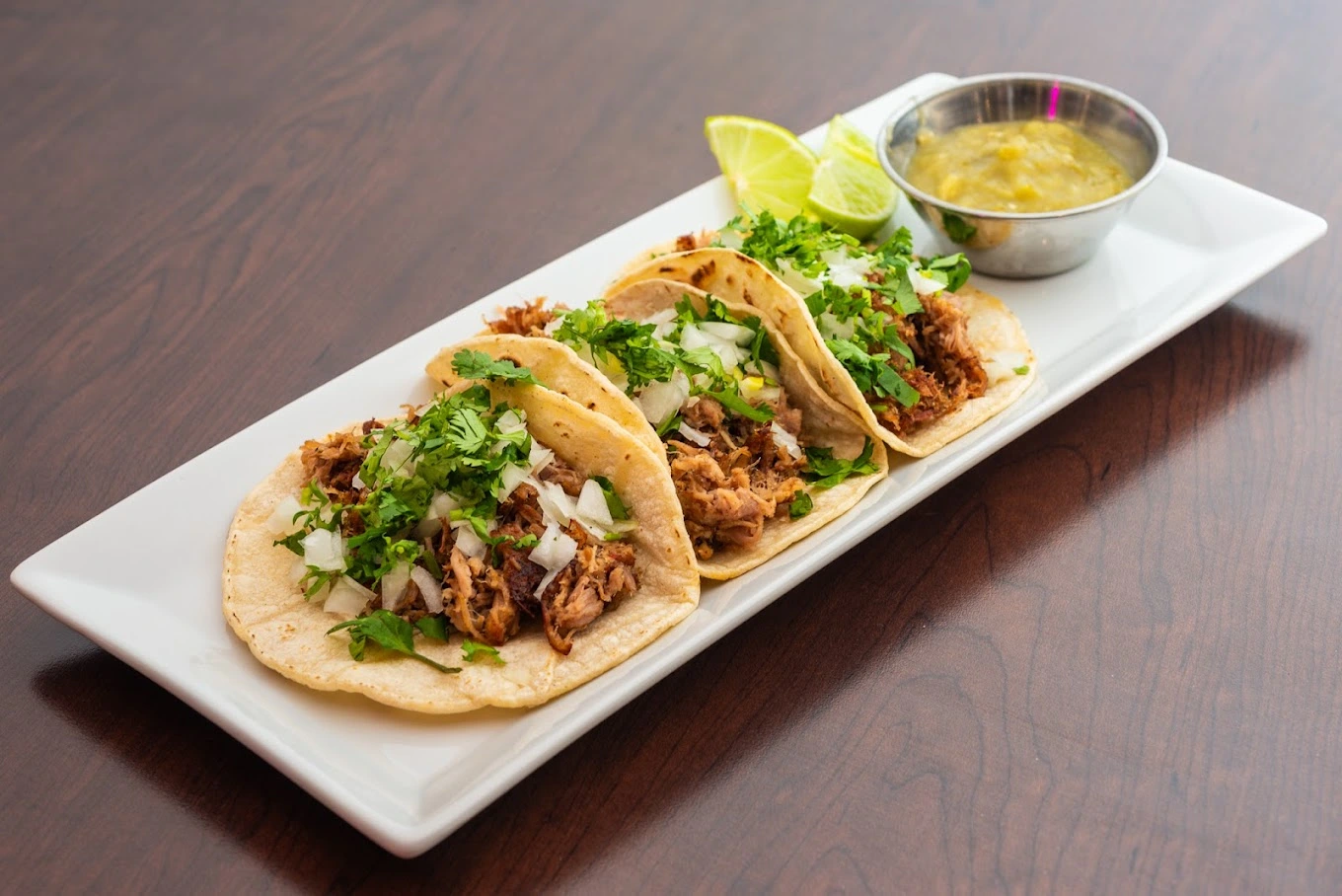 Authentic Birria Tacos with consomé at Birria Cantina Calgary